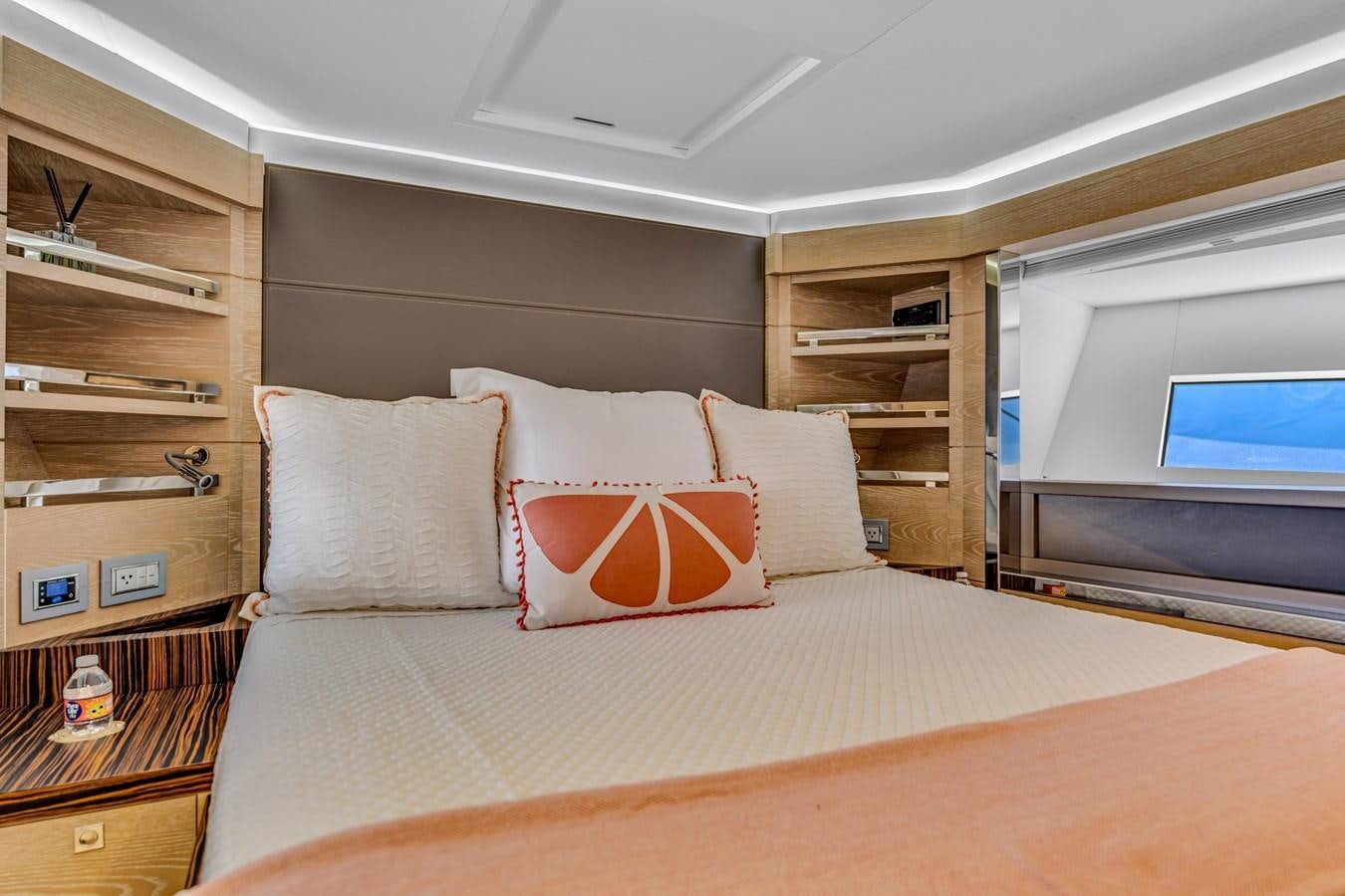 a bed with pillows on it aboard SEADUCTION Yacht for Sale