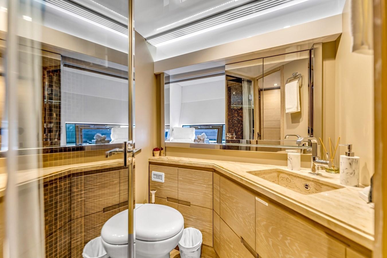 a bathroom with a sink and a toilet aboard SEADUCTION Yacht for Sale
