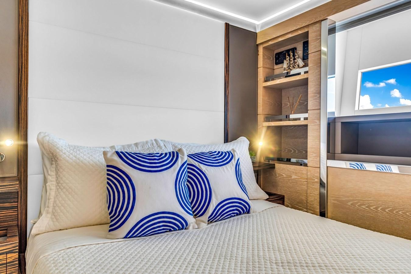 a bed with pillows aboard SEADUCTION Yacht for Sale