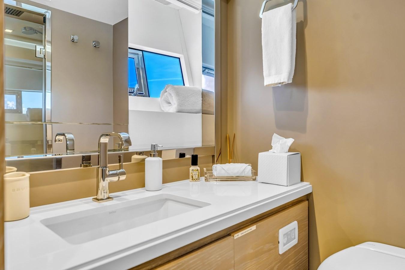 a bathroom with a large mirror aboard SEADUCTION Yacht for Sale