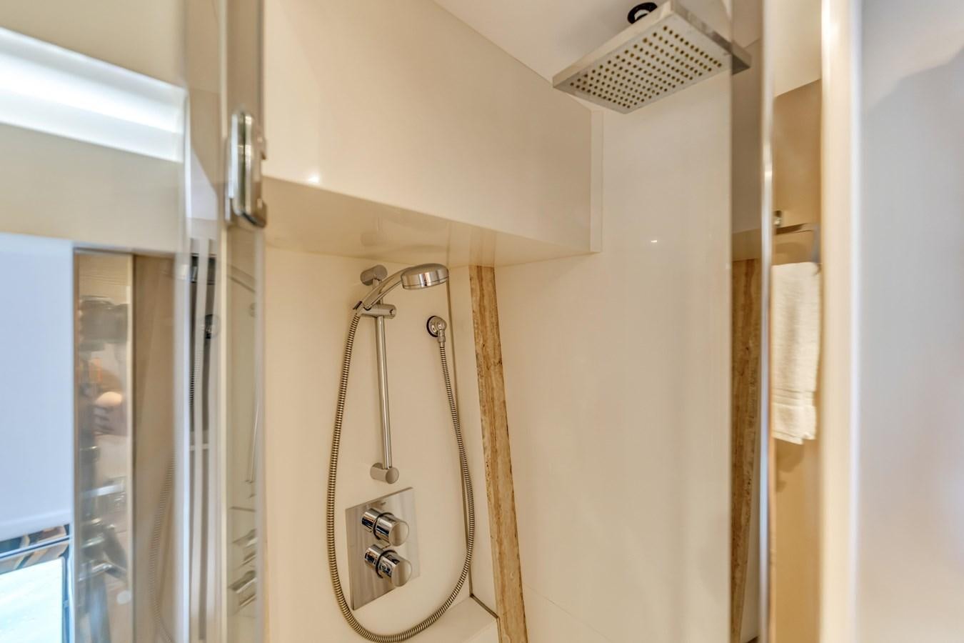 a bathroom with a shower aboard SEADUCTION Yacht for Sale