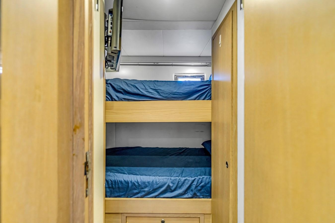 a closet with a bed and a phone on it aboard SEADUCTION Yacht for Sale