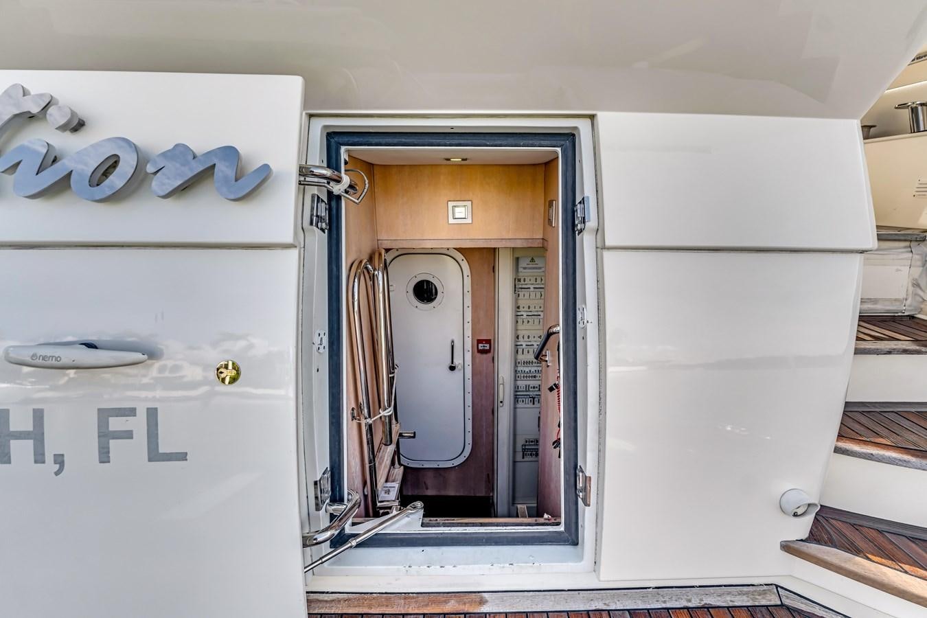 a white cabinet with a door open aboard SEADUCTION Yacht for Sale