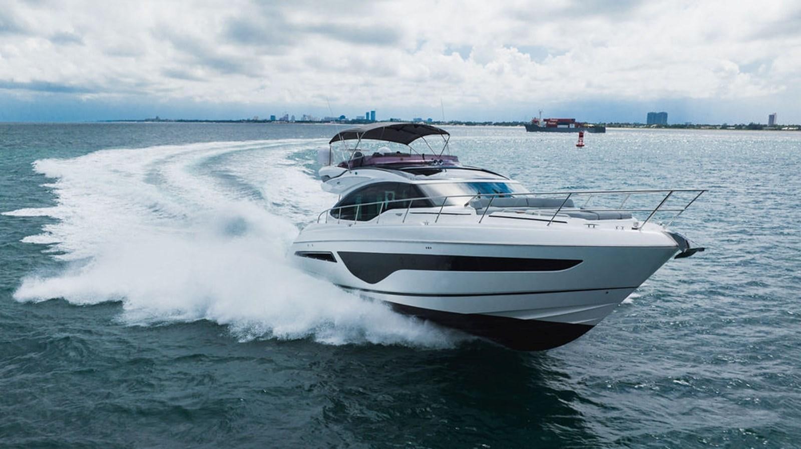 a white yacht on the water aboard IMAGINE Yacht for Sale