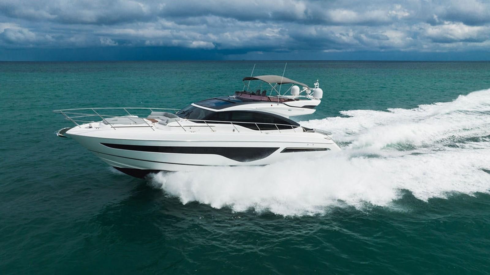 a white yacht in the ocean aboard IMAGINE Yacht for Sale