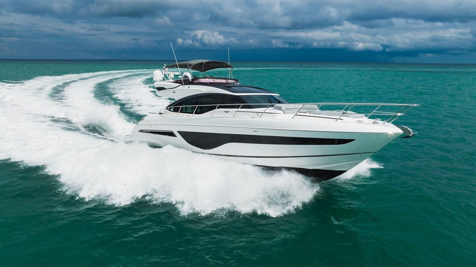 a white yacht on the water aboard IMAGINE Yacht for Sale