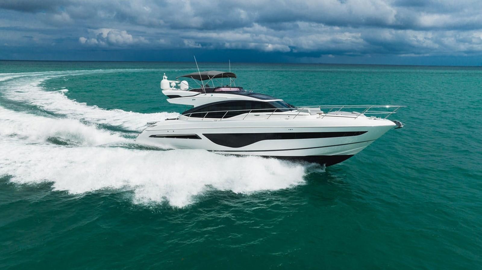 a white yacht in the ocean aboard IMAGINE Yacht for Sale