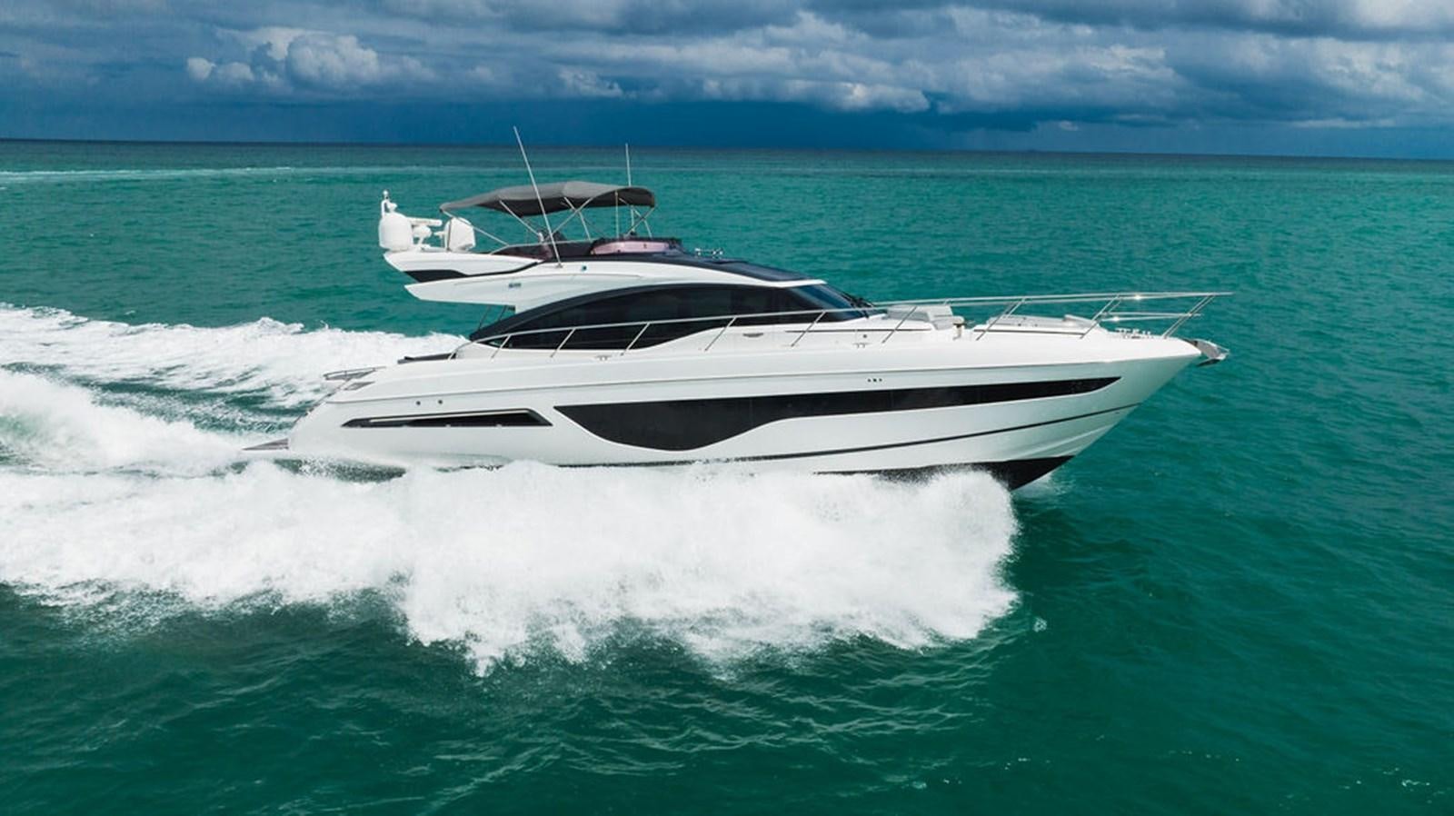 a white boat in the water aboard IMAGINE Yacht for Sale