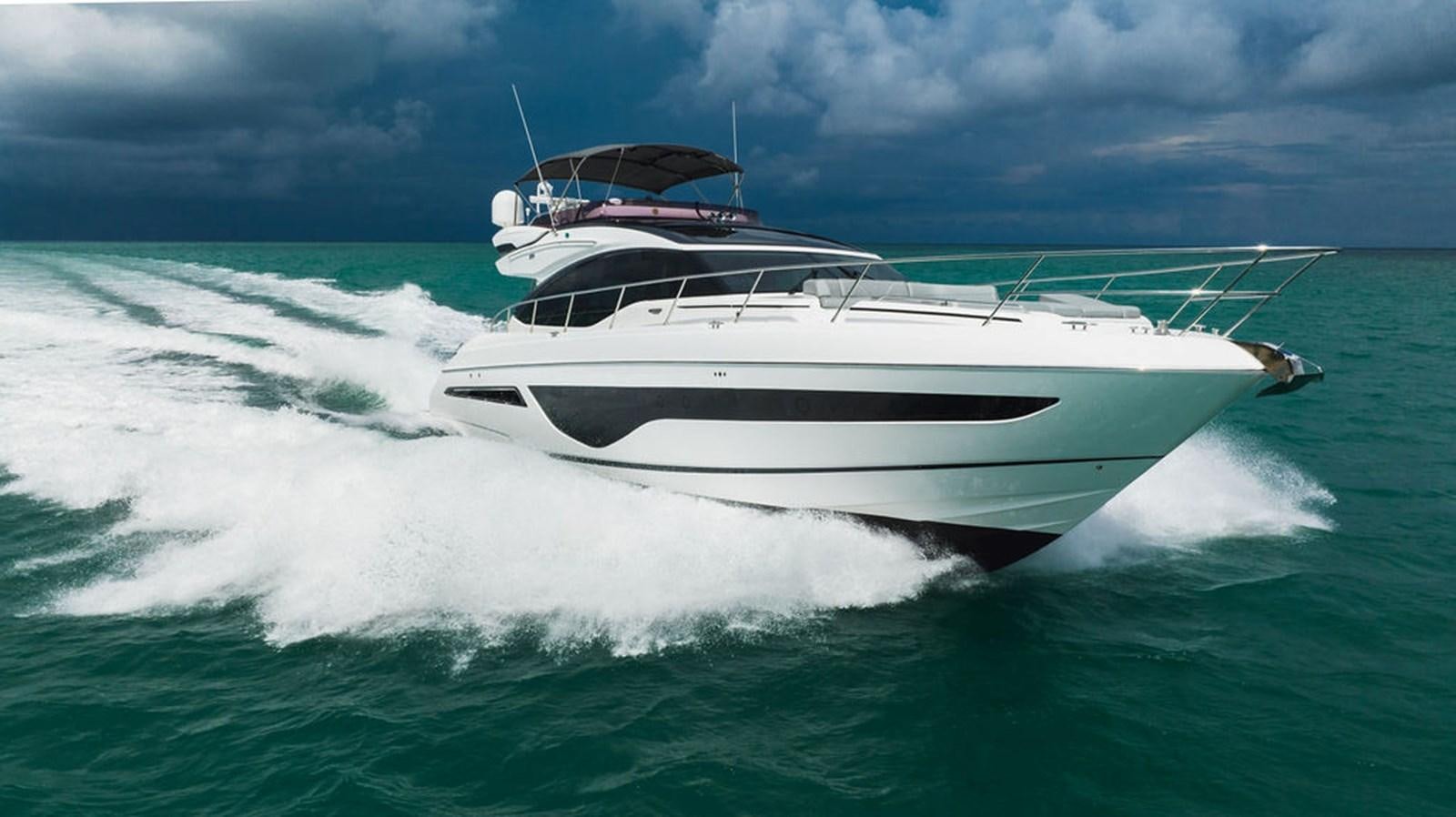 a white boat on the water aboard IMAGINE Yacht for Sale