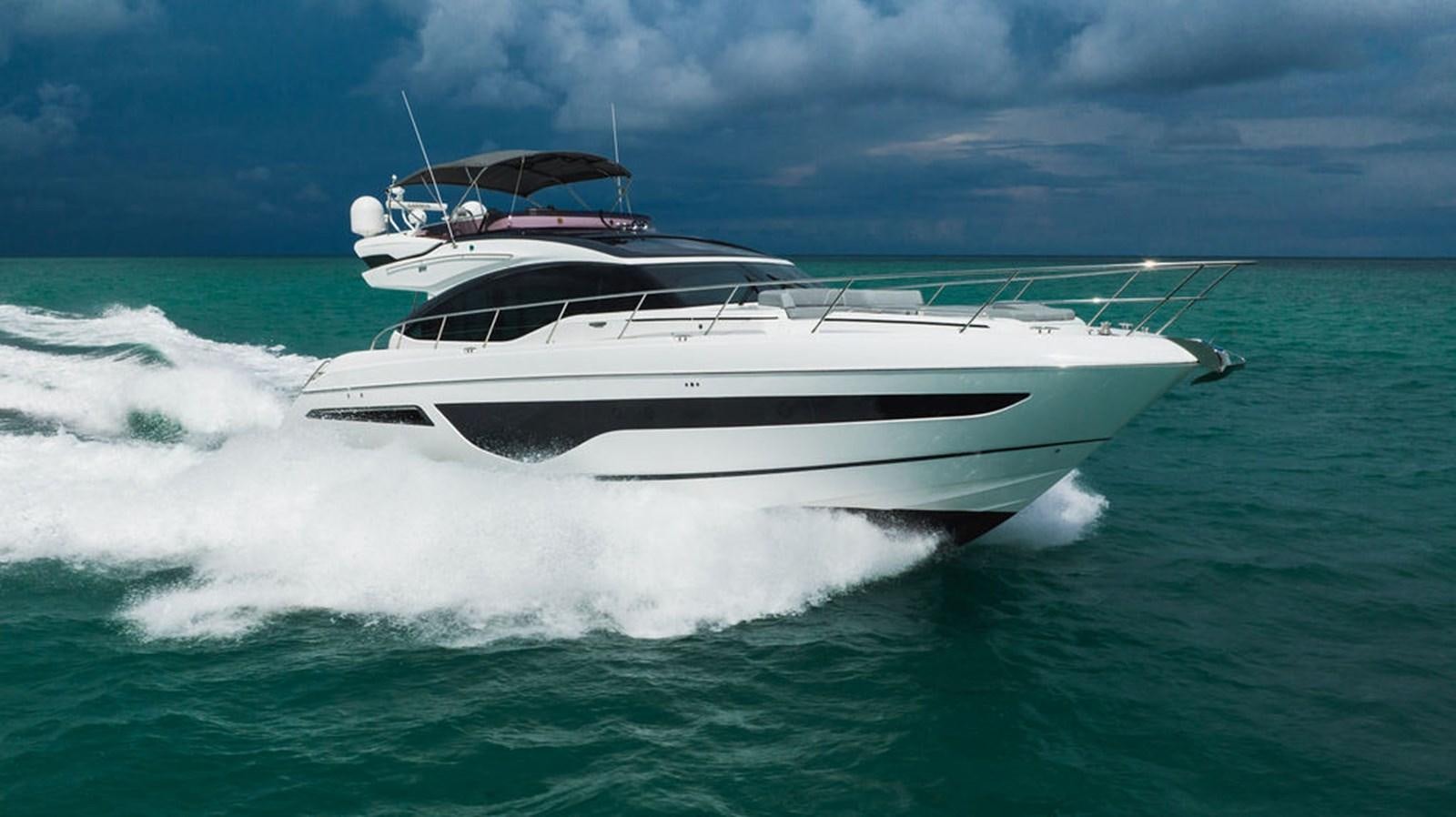 a white yacht on the water aboard IMAGINE Yacht for Sale