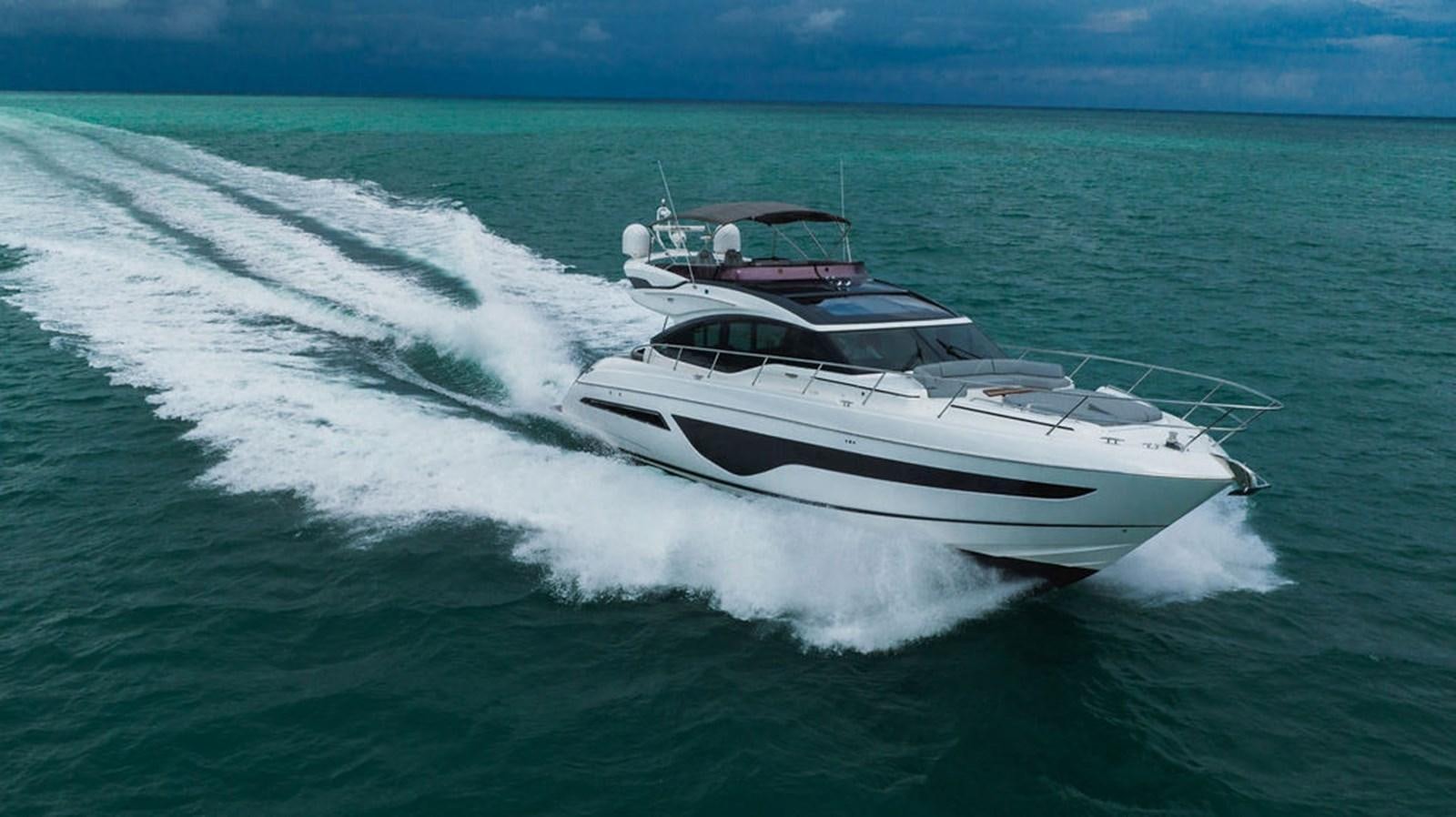 a white yacht on the water aboard IMAGINE Yacht for Sale