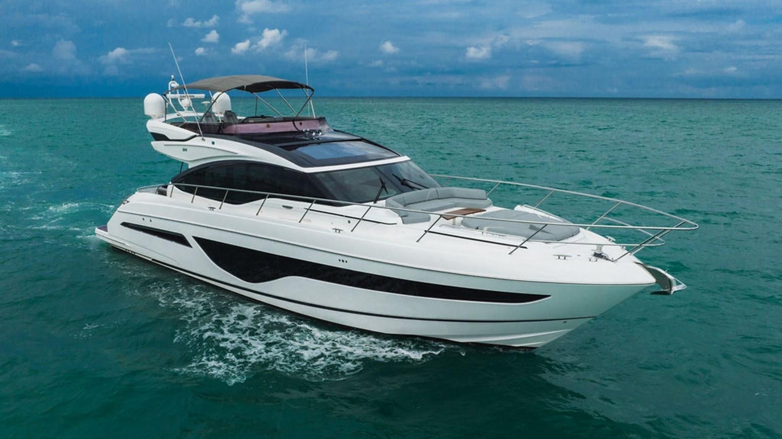 a white yacht in the ocean aboard IMAGINE Yacht for Sale