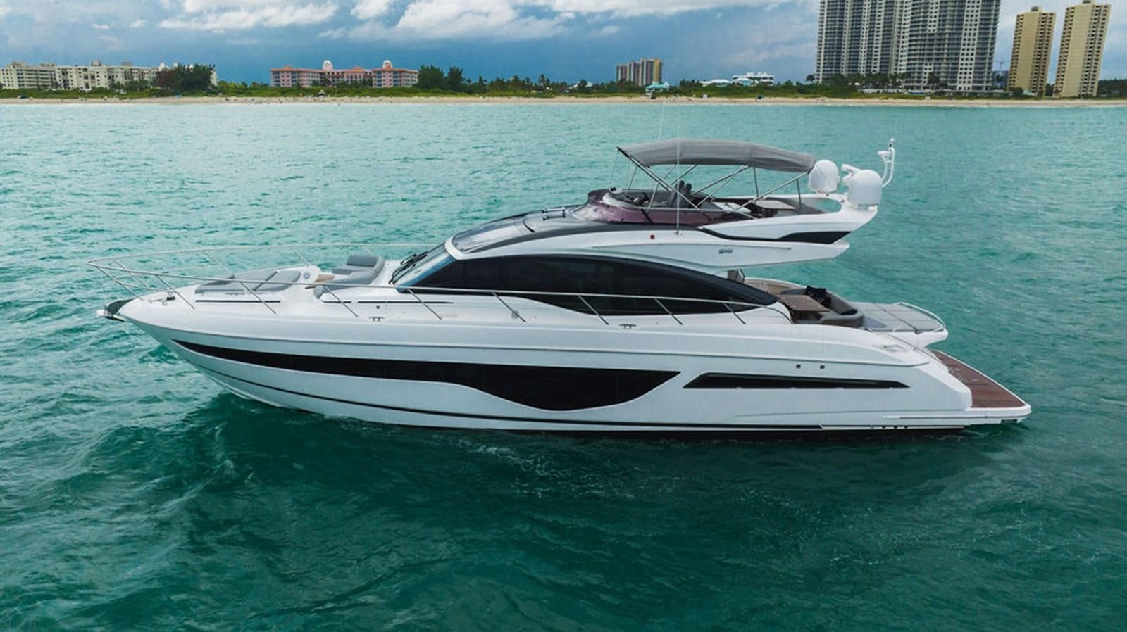 a white boat in the water aboard IMAGINE Yacht for Sale