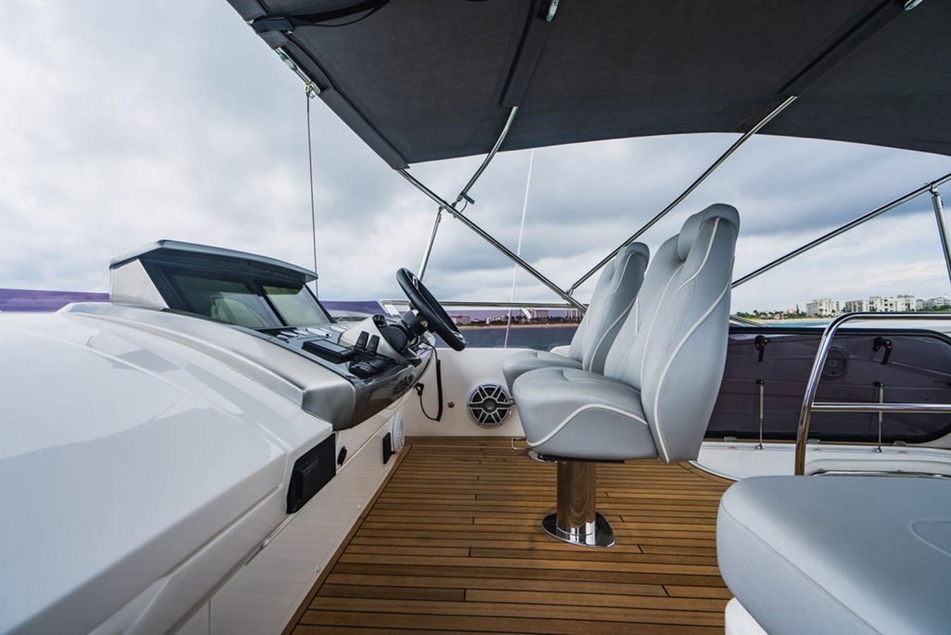 a white airplane with a chair aboard IMAGINE Yacht for Sale