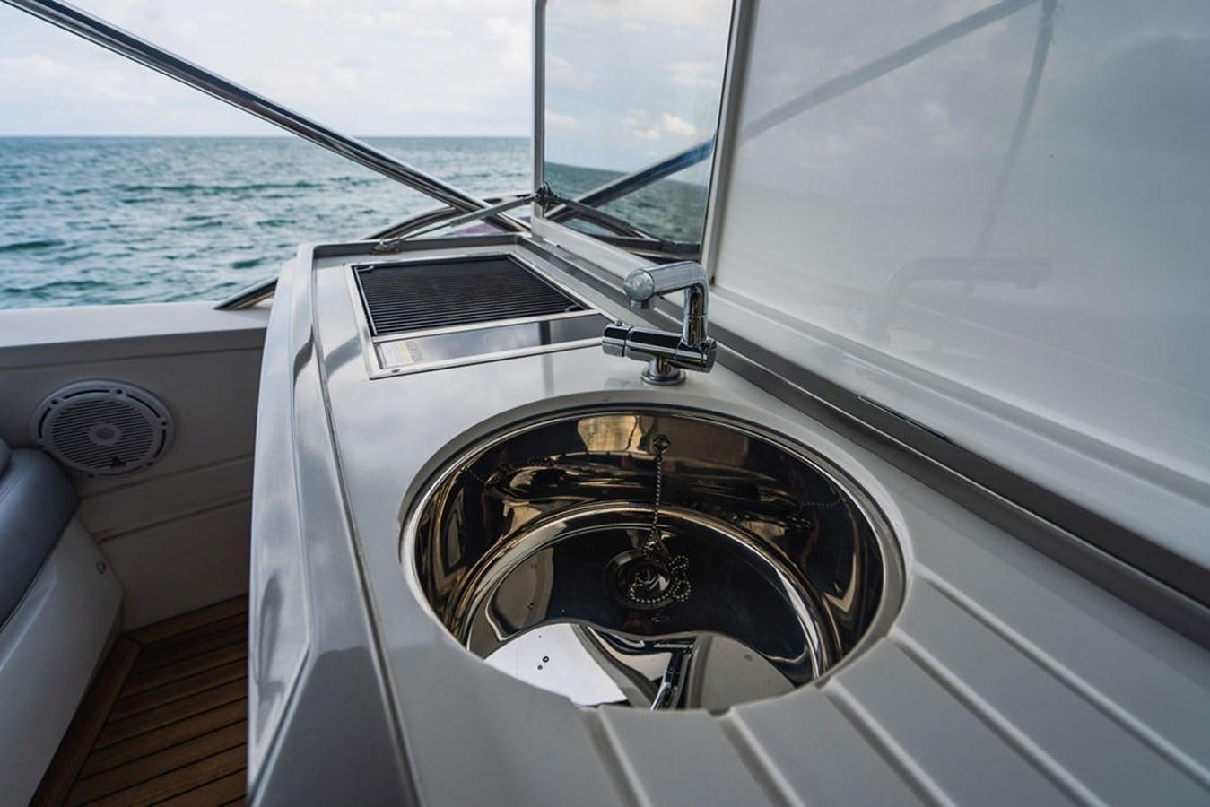 the steering wheel of a boat aboard IMAGINE Yacht for Sale