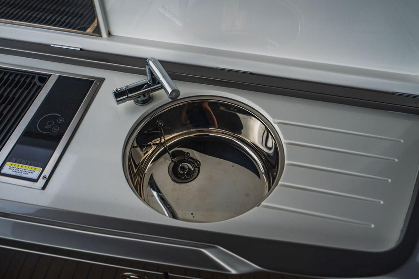 a close-up of a washing machine aboard IMAGINE Yacht for Sale