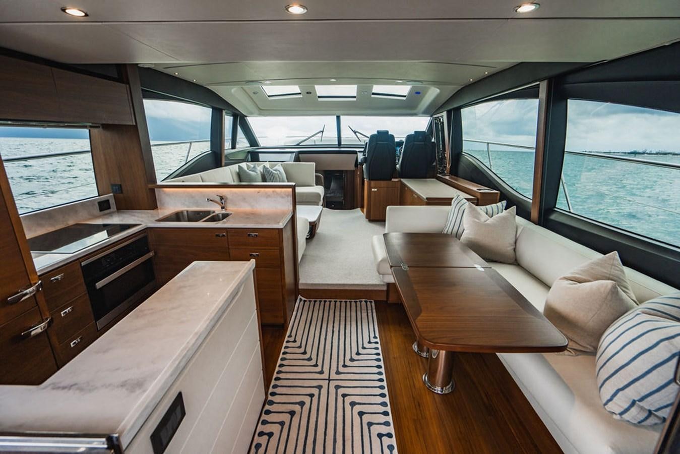 a room with a couch and a desk aboard IMAGINE Yacht for Sale