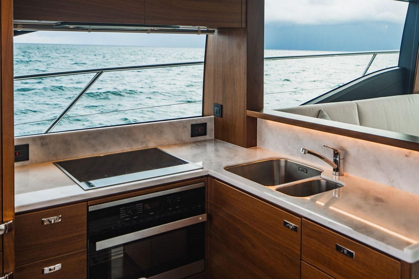 a kitchen with a sink and a window aboard IMAGINE Yacht for Sale