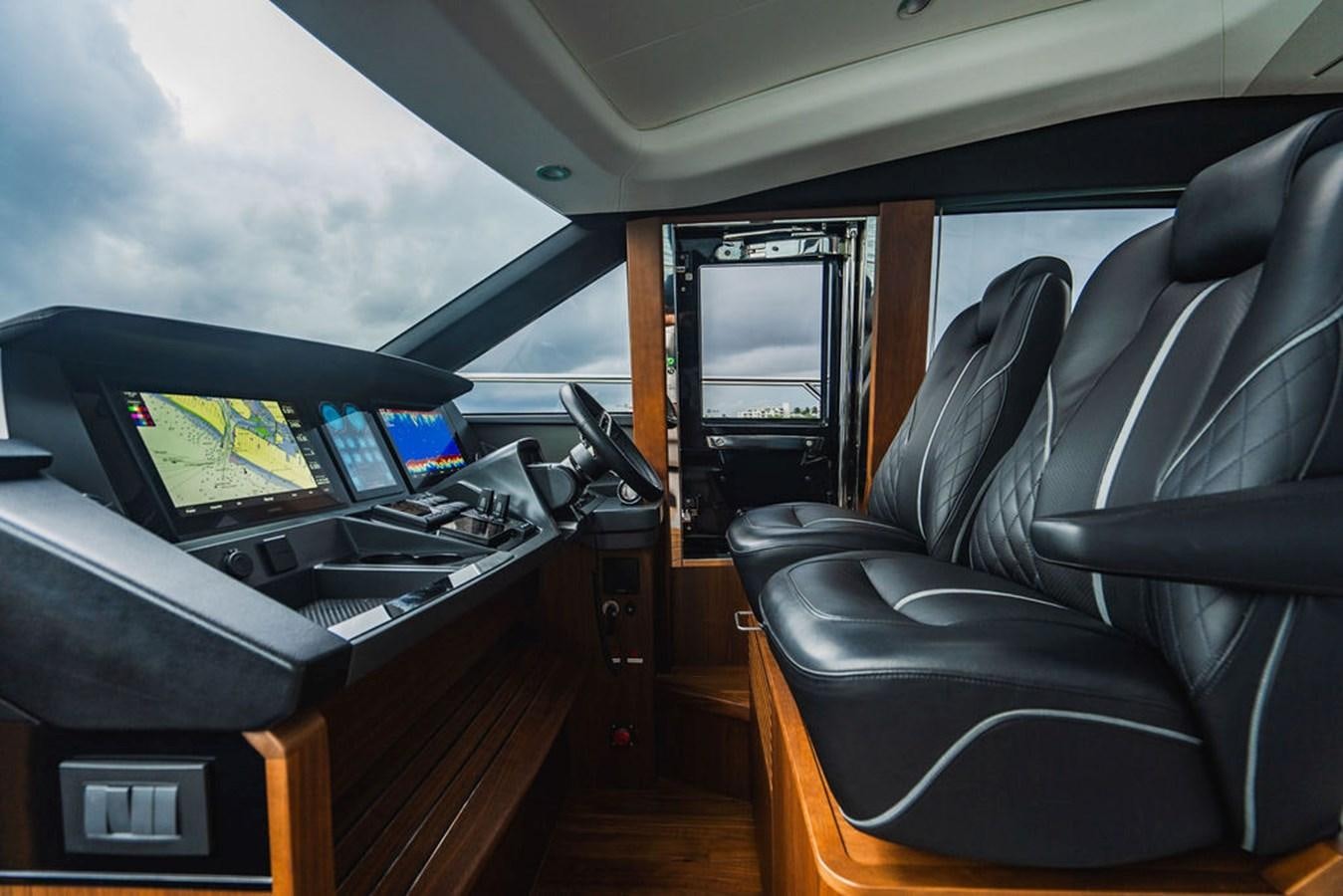 a room with a desk and chairs aboard IMAGINE Yacht for Sale