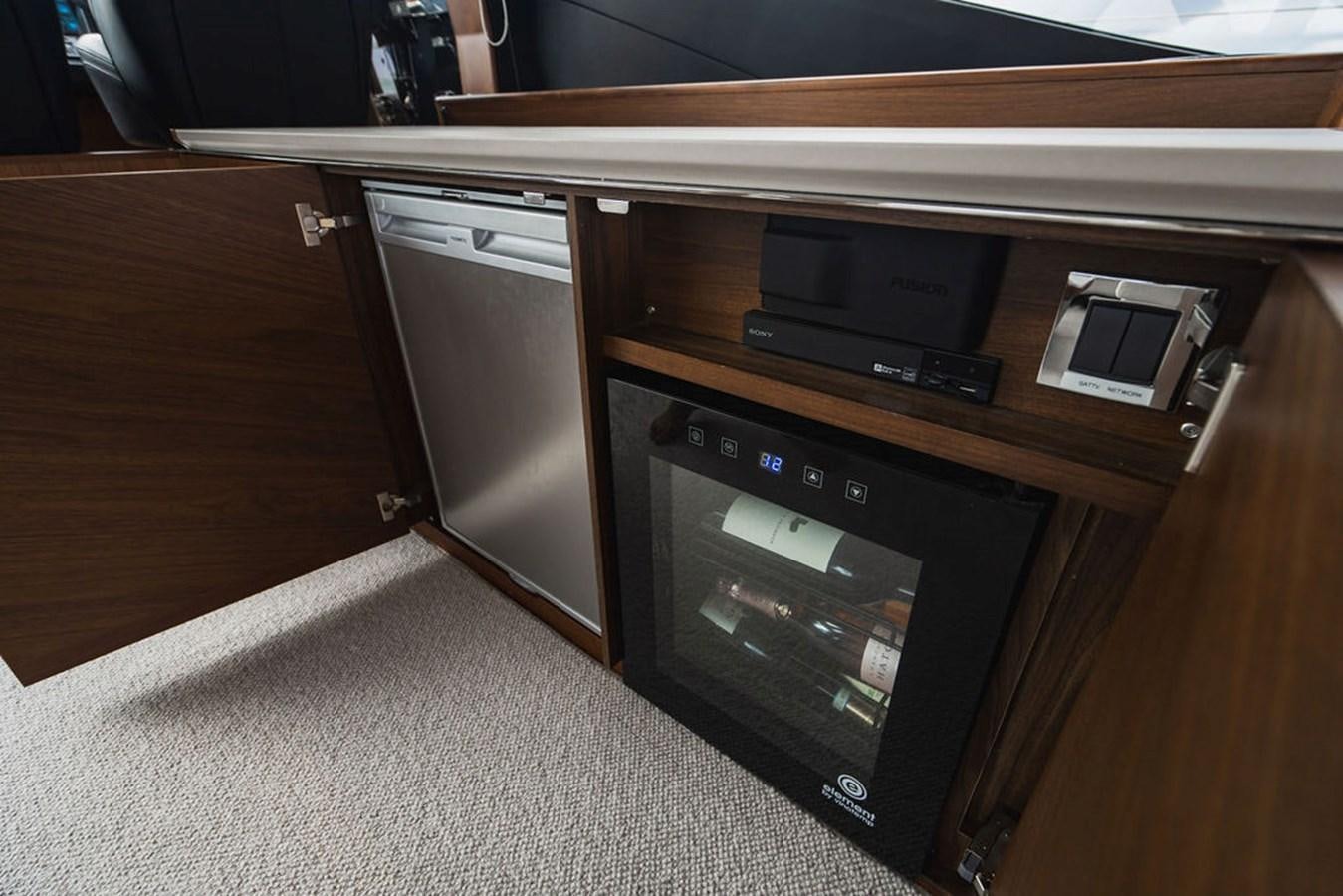 a group of electronic devices on a desk aboard IMAGINE Yacht for Sale