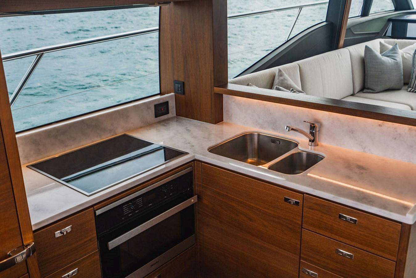 a kitchen with a sink and a window aboard IMAGINE Yacht for Sale