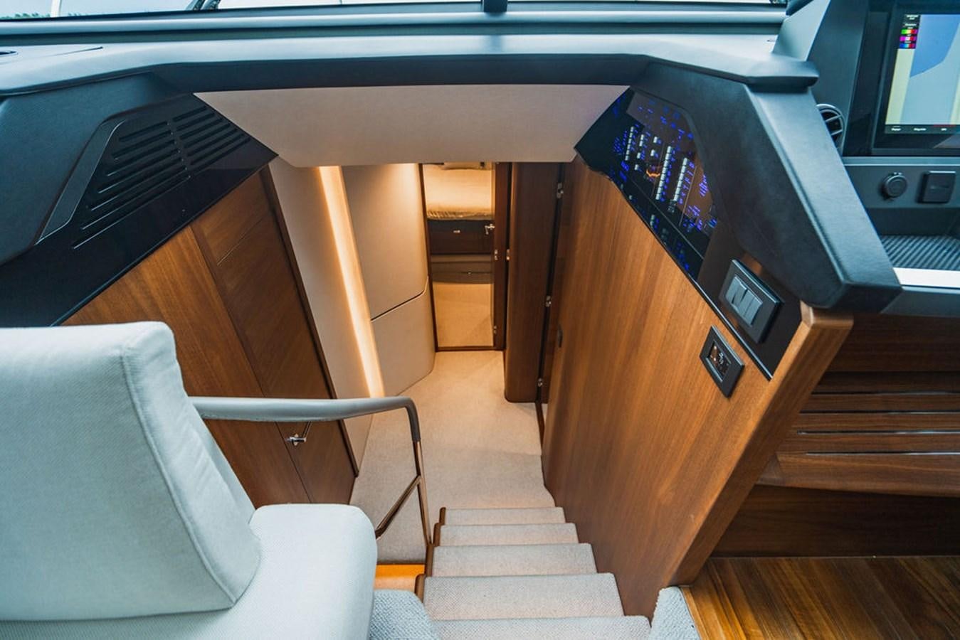 a room with a couch and tv aboard IMAGINE Yacht for Sale