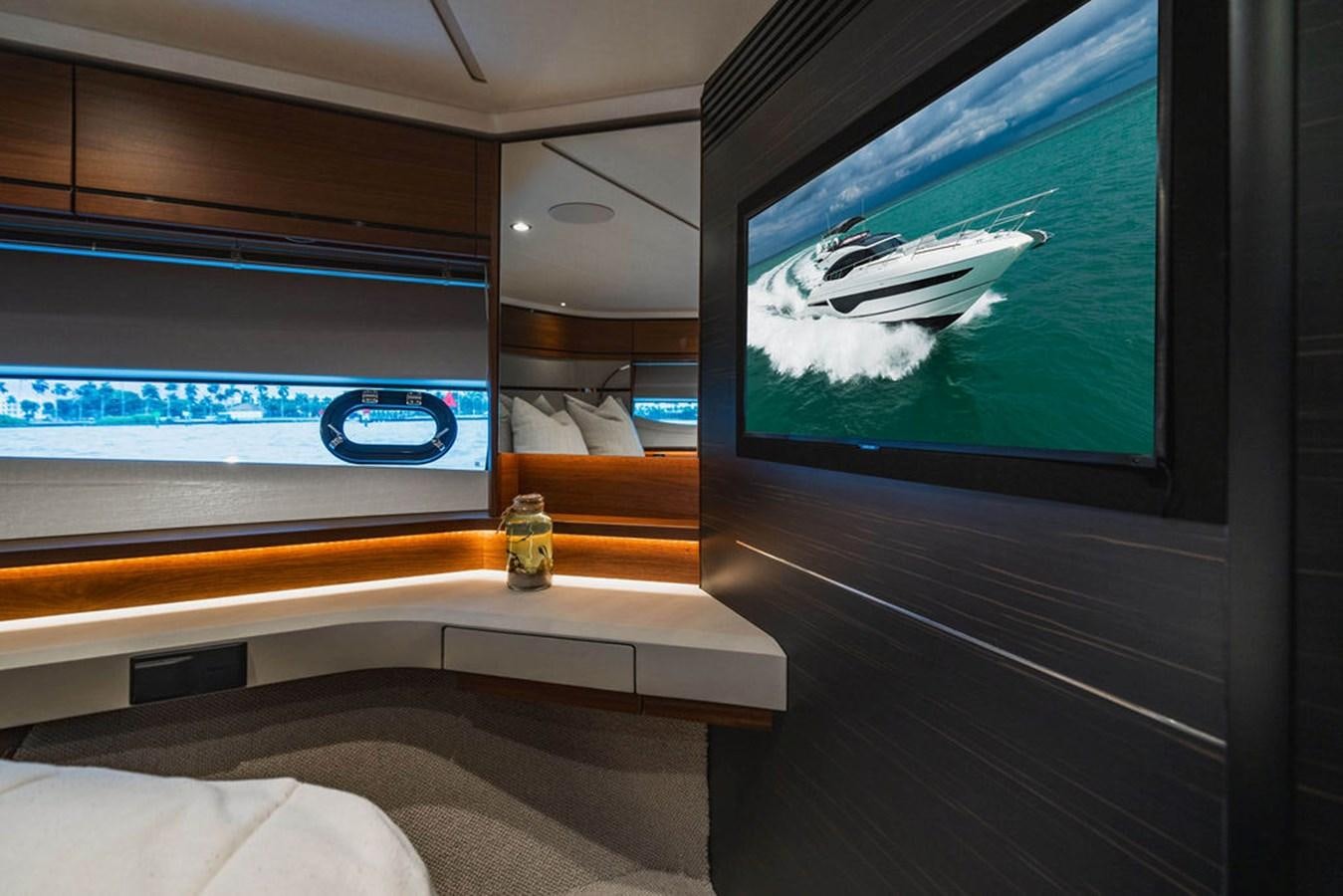 a tv on a wall aboard IMAGINE Yacht for Sale