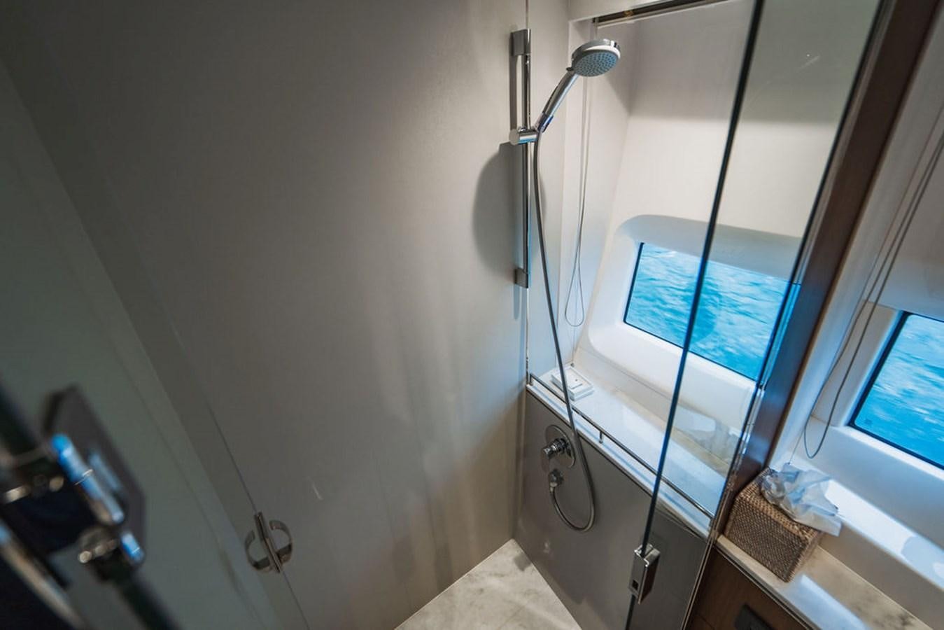 a lamp next to a window aboard IMAGINE Yacht for Sale