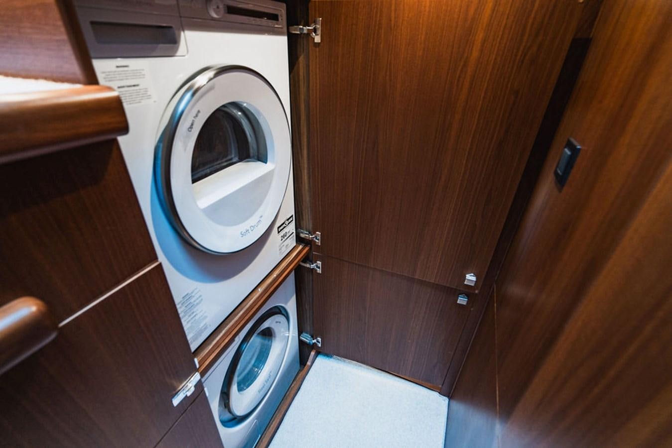 a washing machine in a room aboard IMAGINE Yacht for Sale