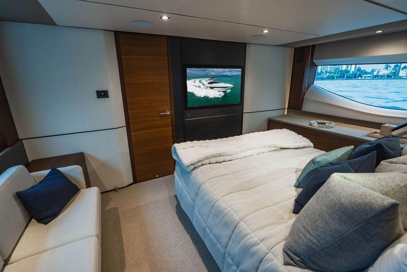a room with a bed and a tv aboard IMAGINE Yacht for Sale
