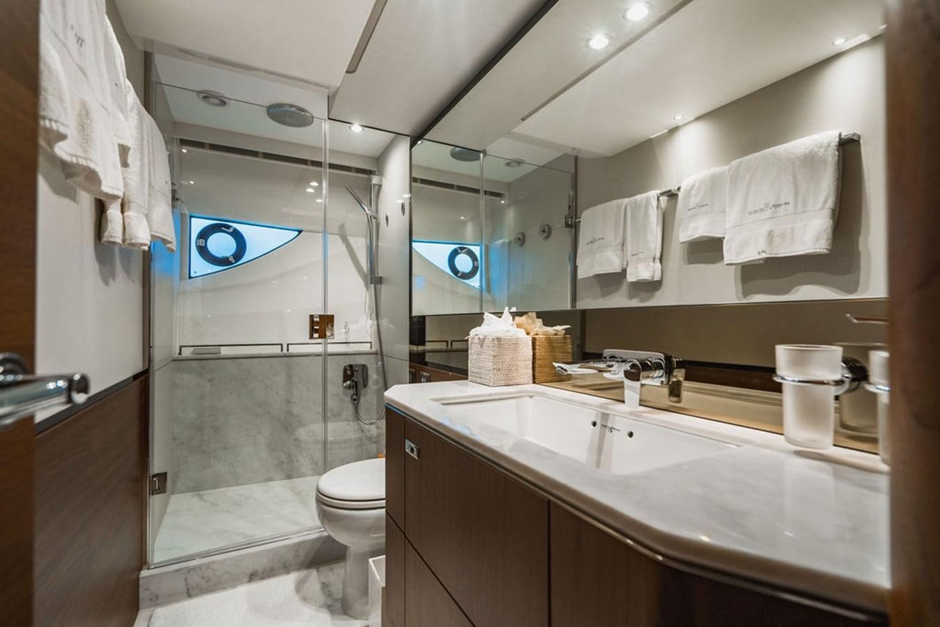 a bathroom with a glass shower aboard IMAGINE Yacht for Sale