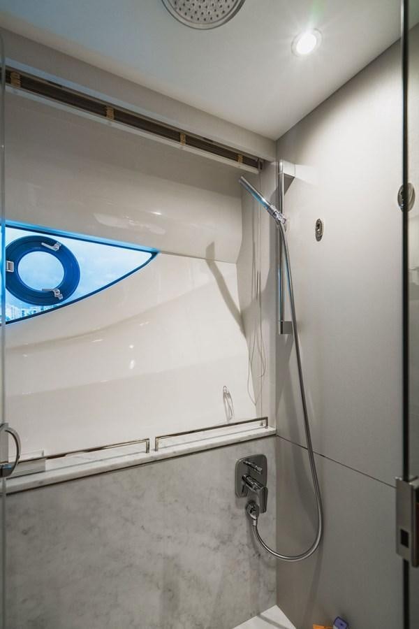 a shower with a blue circle aboard IMAGINE Yacht for Sale