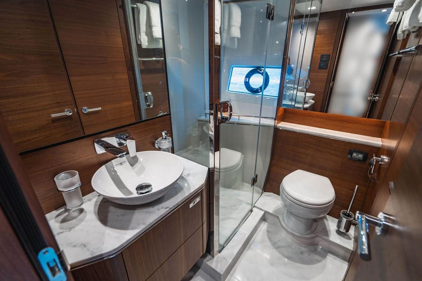 a bathroom with a glass shower aboard IMAGINE Yacht for Sale