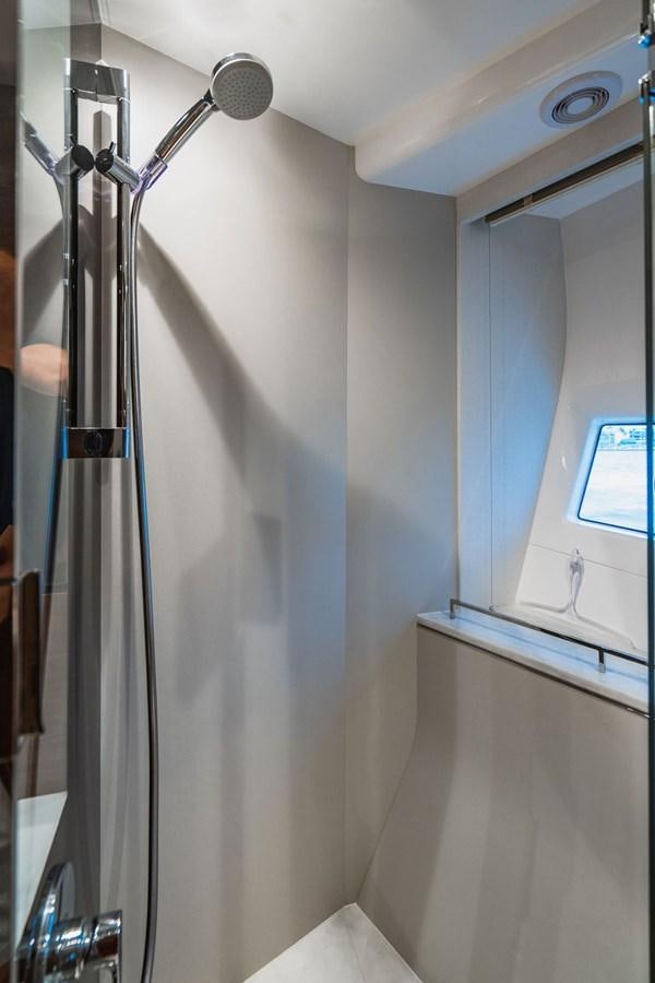 a shower head in a bathroom aboard IMAGINE Yacht for Sale