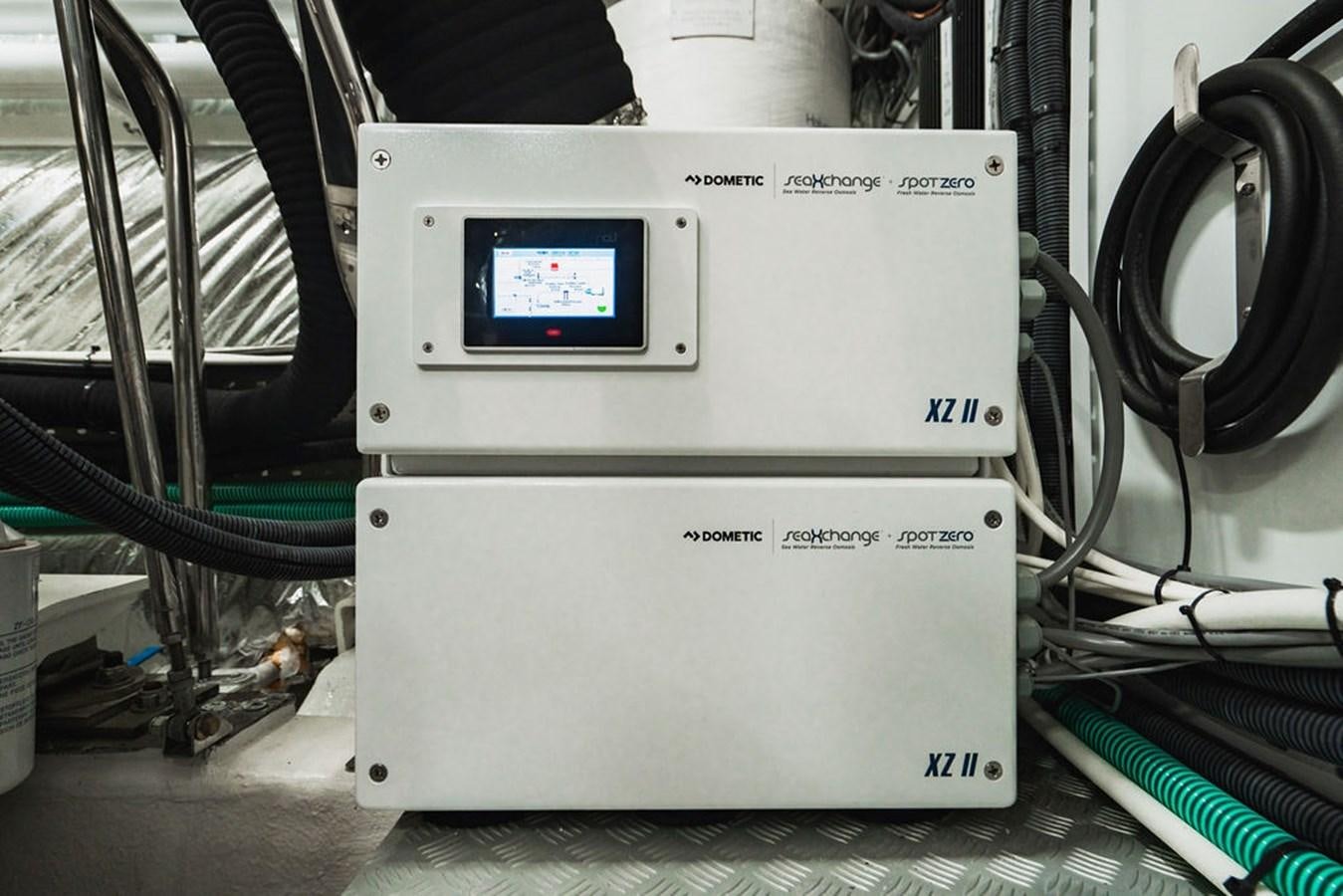 a white machine with a screen aboard IMAGINE Yacht for Sale