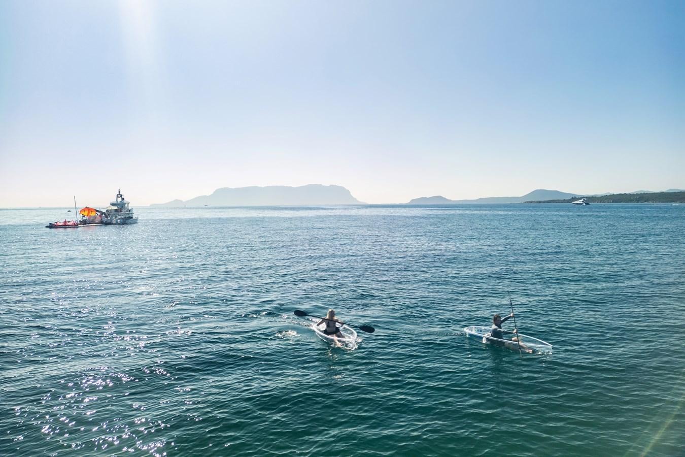 a group of people in a boat aboard SHADOW Yacht for Sale