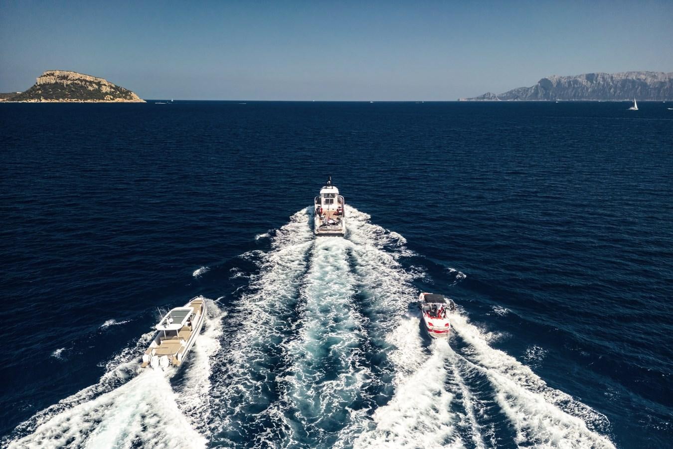 a snowy road leading to a house aboard SHADOW Yacht for Sale