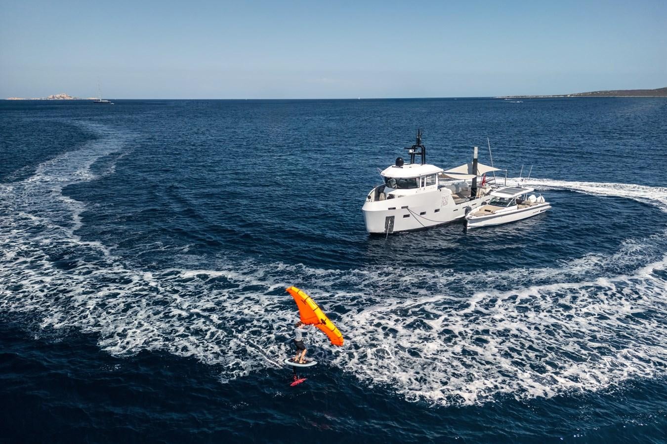 a person parasailing on a boat aboard SHADOW Yacht for Sale
