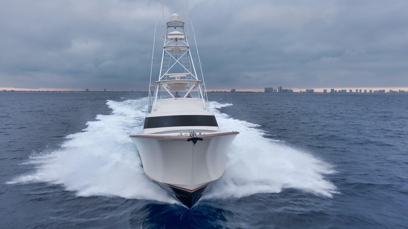 a white boat on water aboard WHISKEY KILO Yacht for Sale