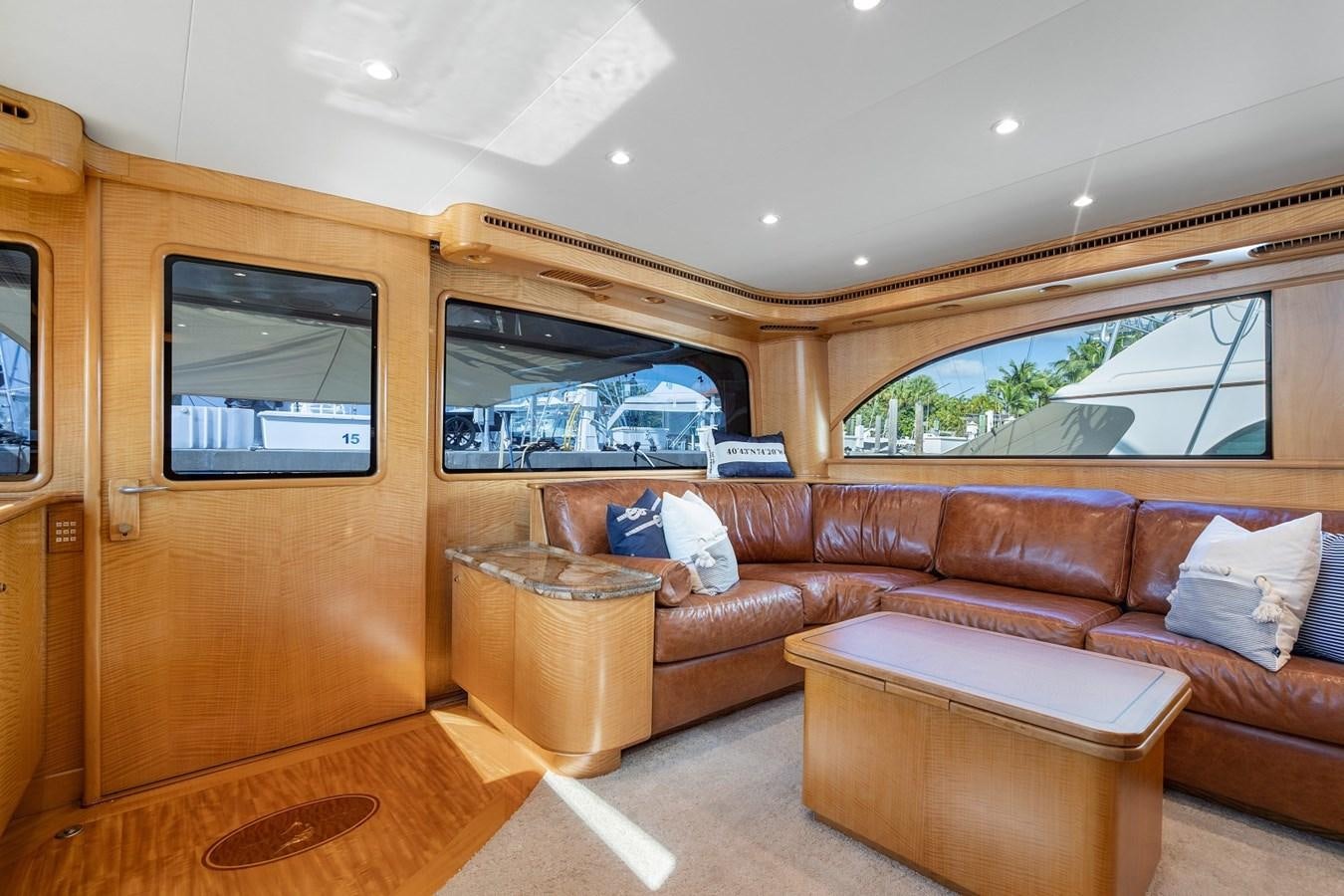 a living room with a couch and a table aboard WHISKEY KILO Yacht for Sale