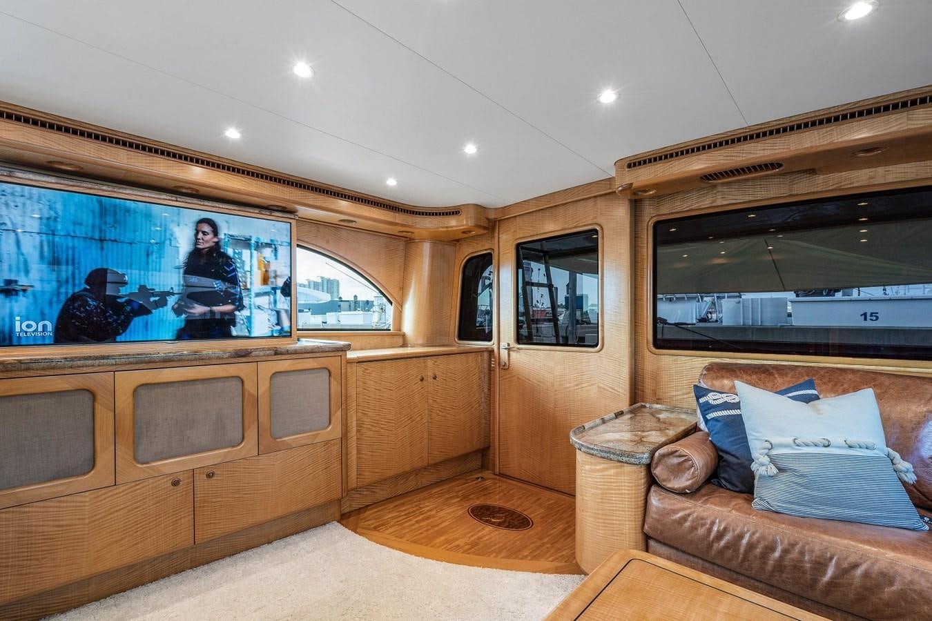 a living room with a tv and a couch aboard WHISKEY KILO Yacht for Sale