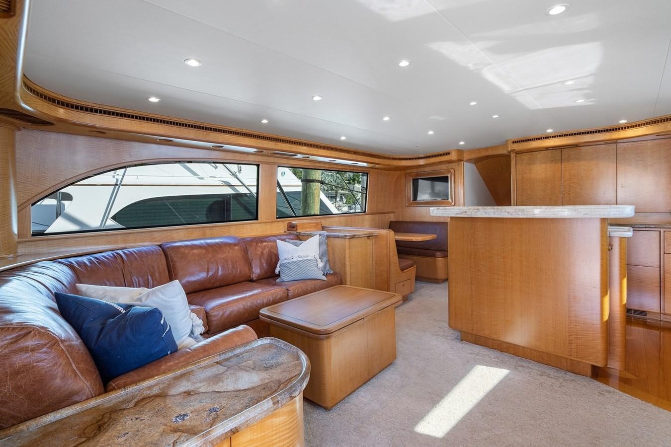 a living room with a wood floor aboard WHISKEY KILO Yacht for Sale