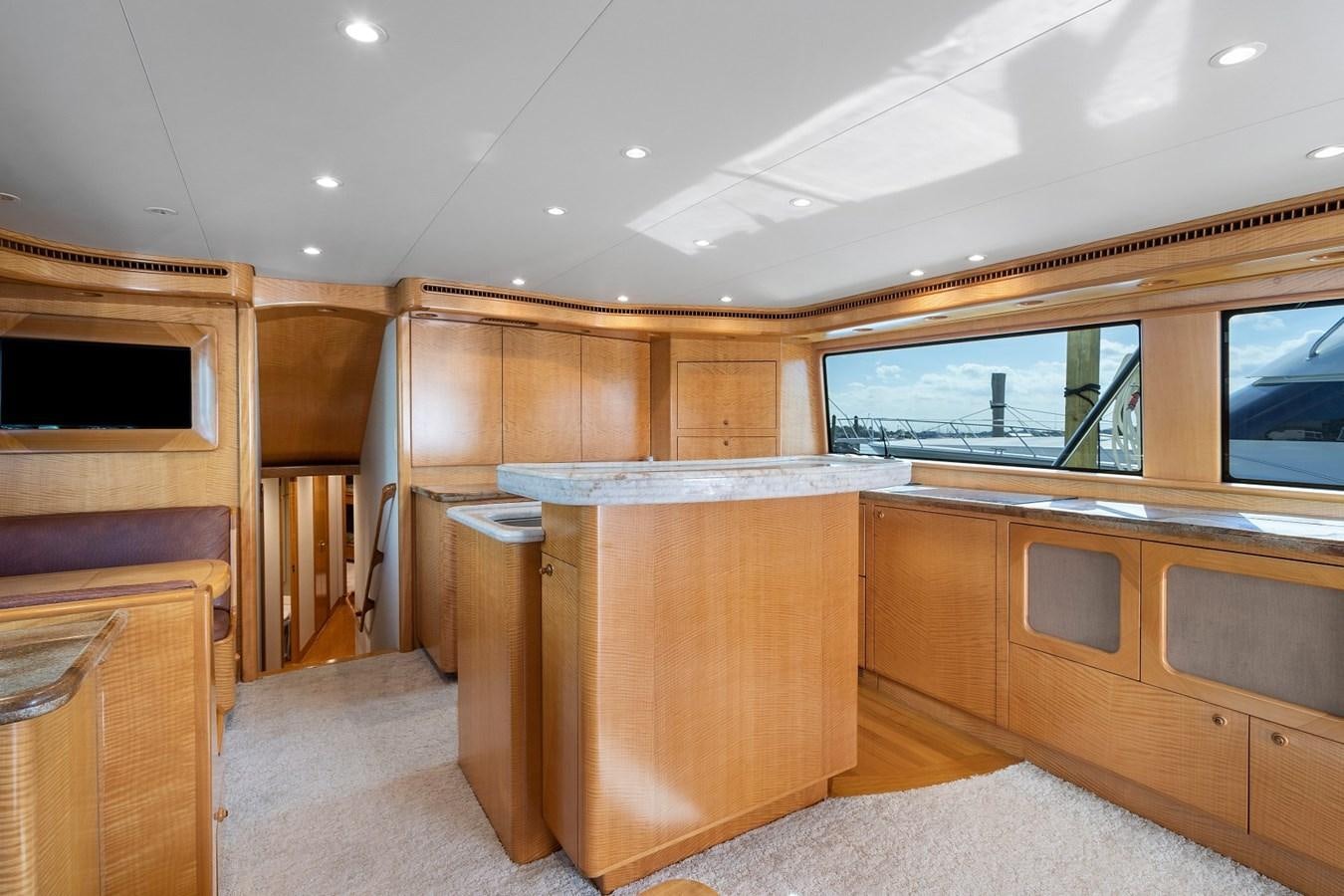 a room with wooden cabinets aboard WHISKEY KILO Yacht for Sale