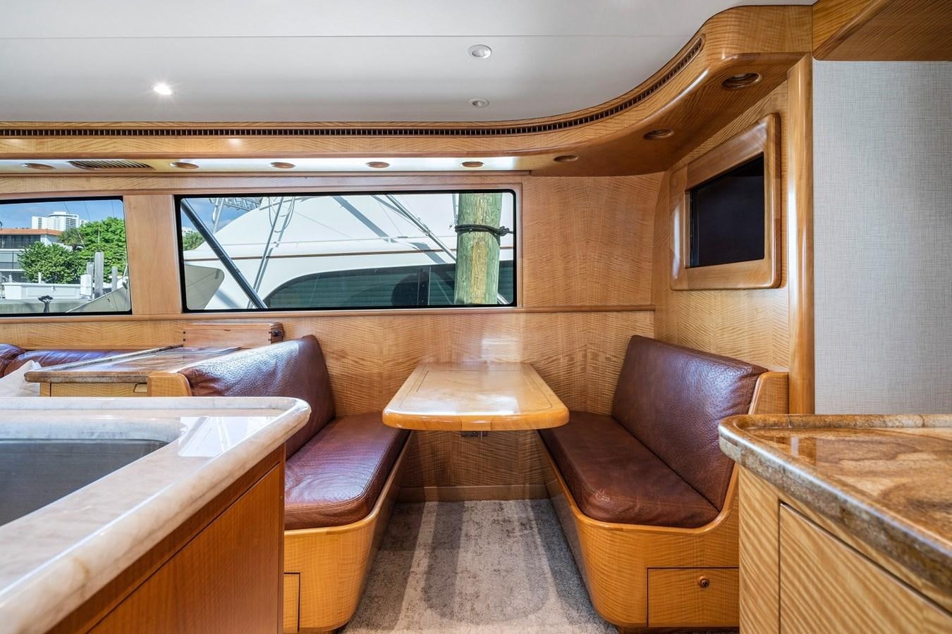 a room with a couch and a table aboard WHISKEY KILO Yacht for Sale