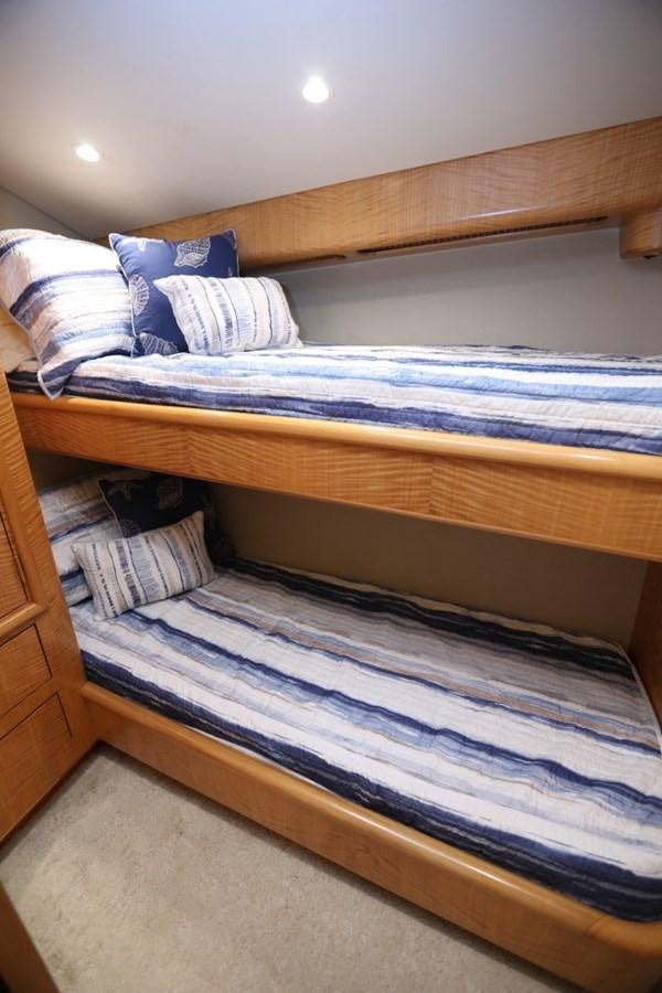 a bed with blue sheets aboard WHISKEY KILO Yacht for Sale