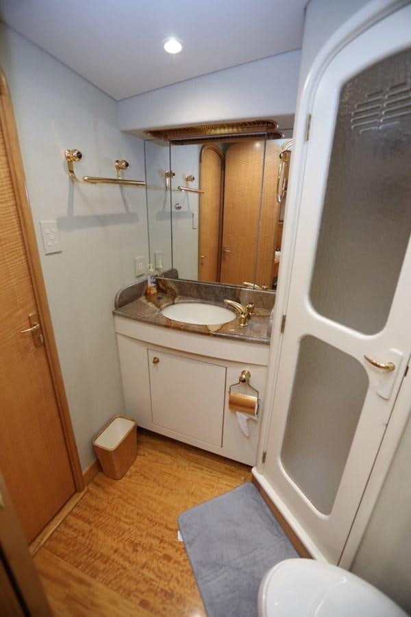 a bathroom with a sink and a mirror aboard WHISKEY KILO Yacht for Sale
