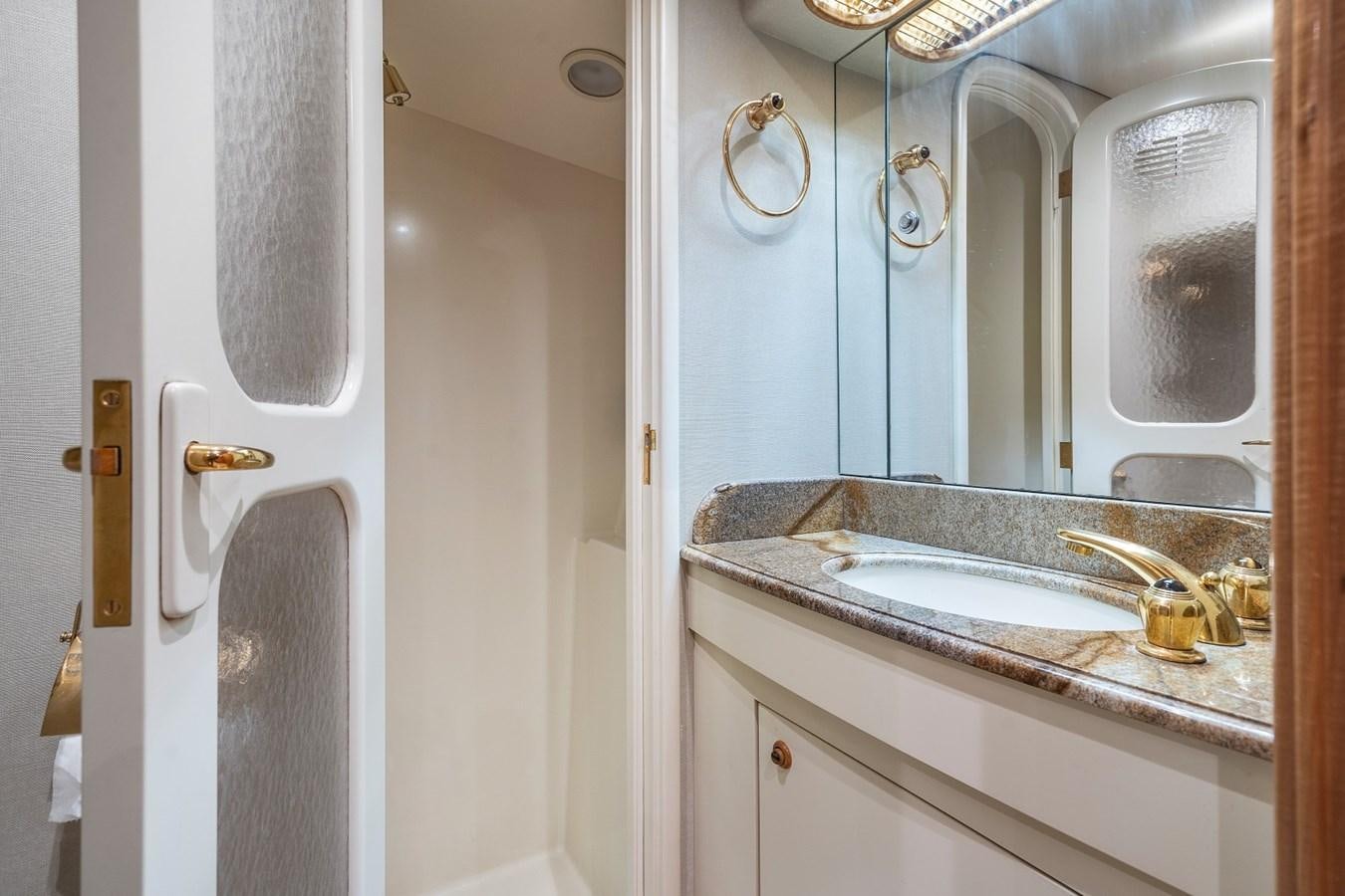 a bathroom with a sink and a mirror aboard WHISKEY KILO Yacht for Sale