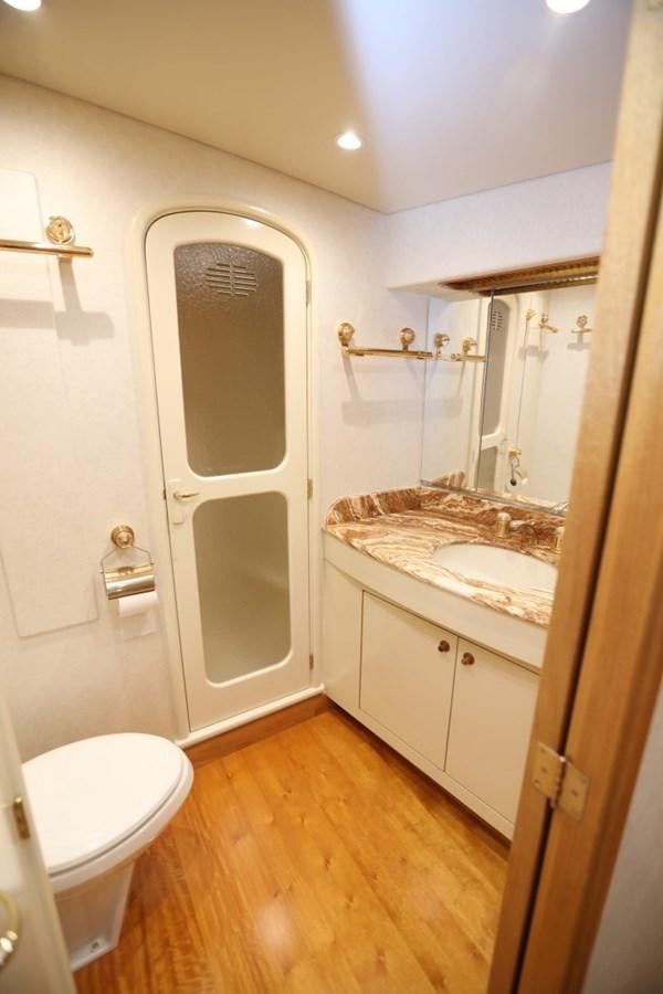 a bathroom with a sink and a toilet aboard WHISKEY KILO Yacht for Sale