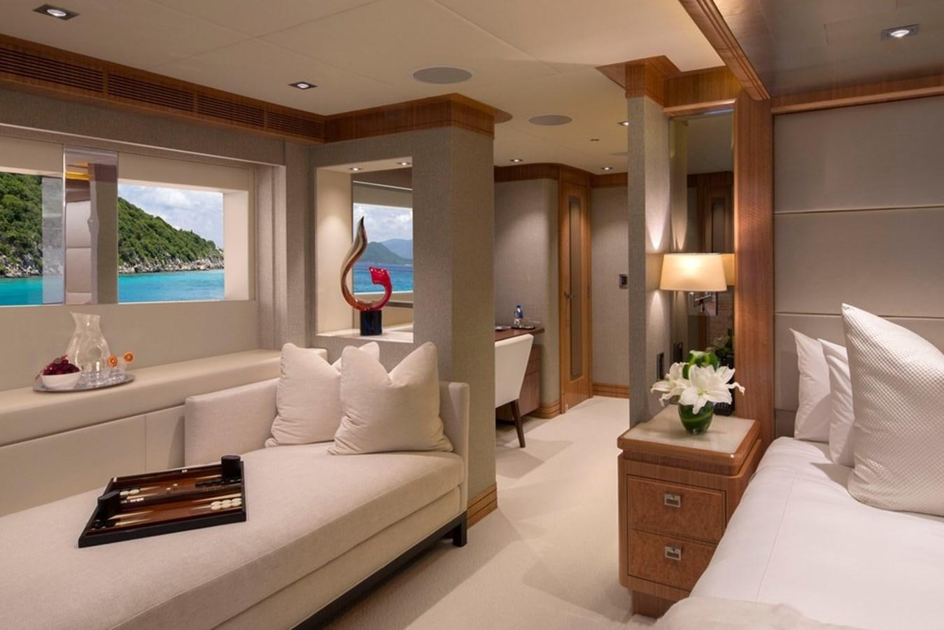 a room with a bed and a mirror aboard MUCHOS MAS Yacht for Sale