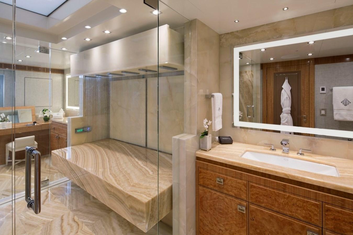 a bathroom with a large mirror aboard MUCHOS MAS Yacht for Sale